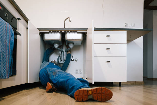 Professional Emergency Plumber technician working in Montezuma, IA